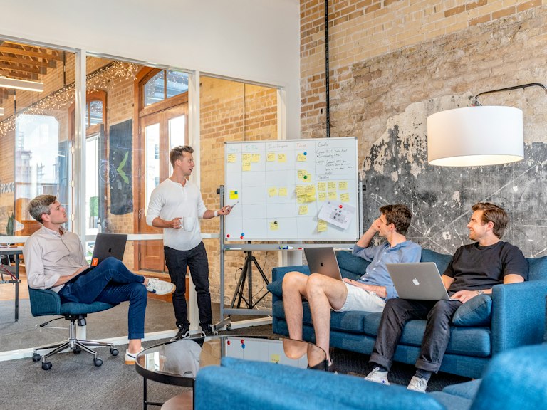 U.S. flag flying near a government building facade