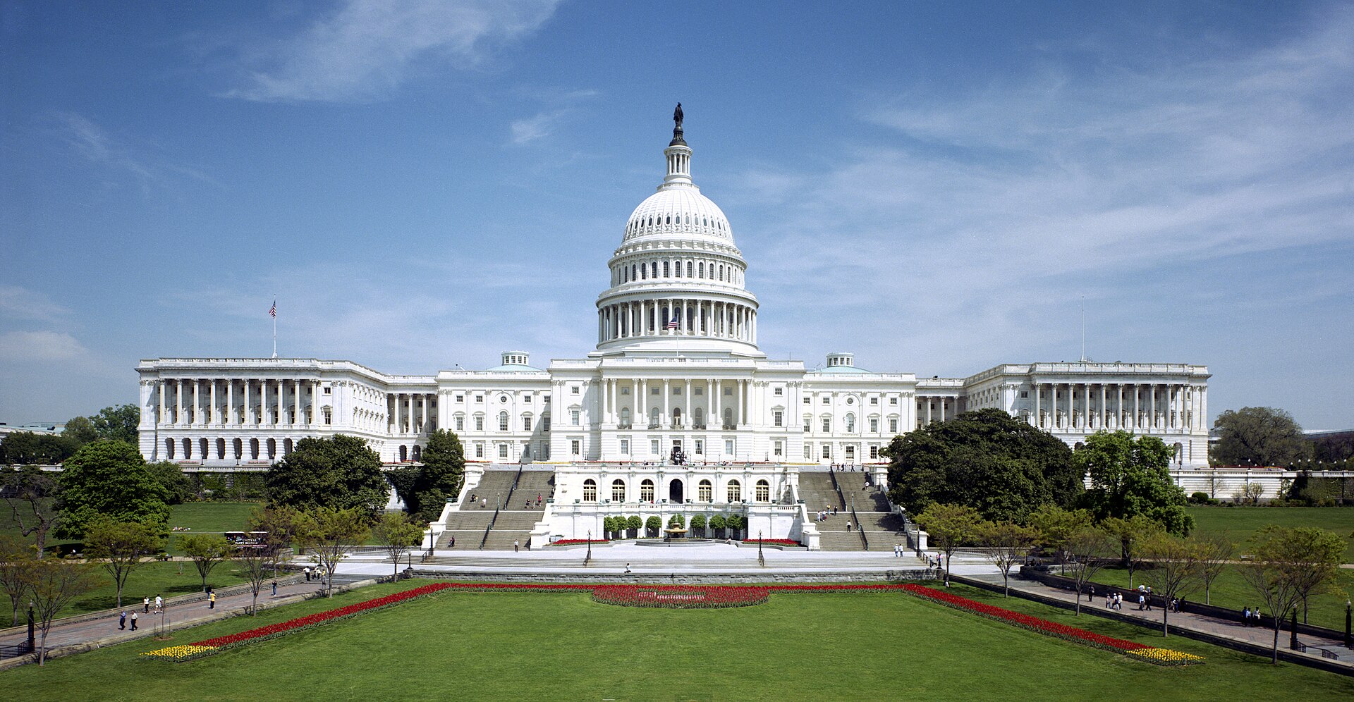 The west front of the United States Capitol under a blue sky