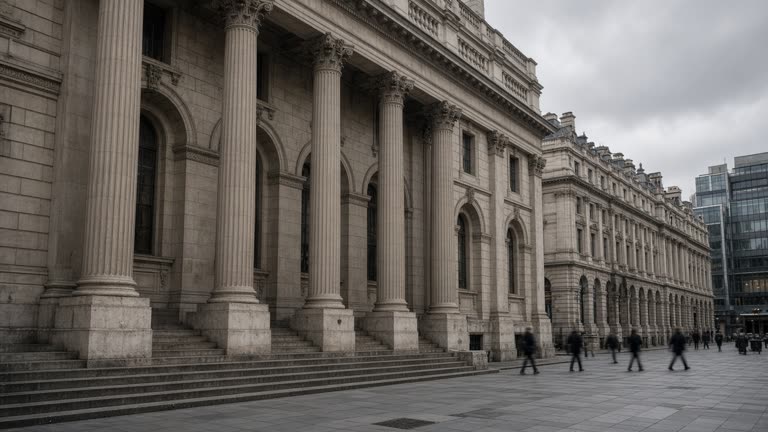 Wide view of the London Stock Exchange building exterior on a grey morning, stone facade, pedestrians blurred in distance, overcast sky, documentary street photography, no readable text or logos