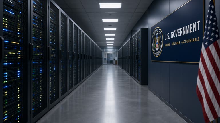 Australian government office corridor with closed server room door and blinking rack lights visible through glass, fluorescent overhead, documentary wire photo, slight underexposure, no readable screens or faces