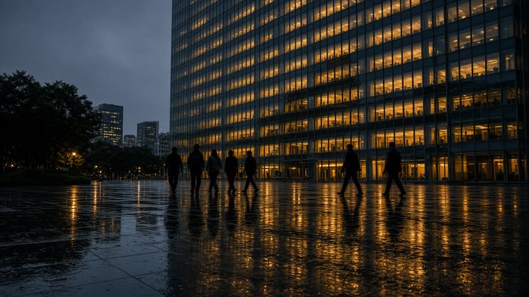 Singapore bank tower facade at dusk reflected in wet pavement, amber office lights in curtain wall grid, pedestrians as silhouettes without faces, no logos or readable text