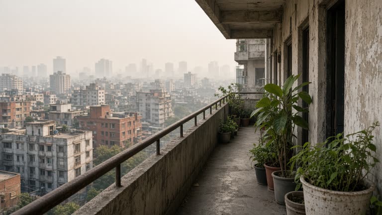 Hazy skyline viewed from a public housing corridor with potted plants, muted sunlight, distant blocks fading in smog, no people or readable signs